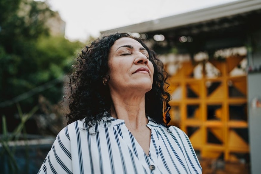 A person taking a deep breath