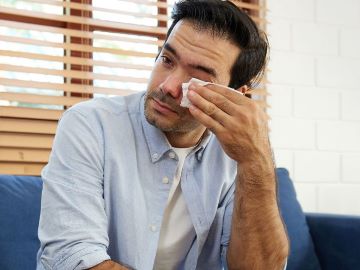 Person using eye drops